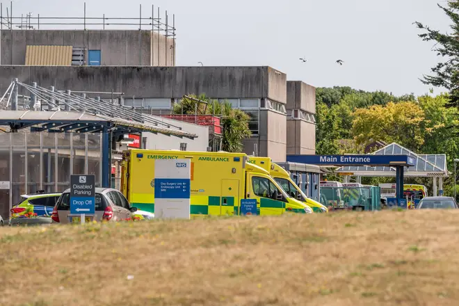 Ambulances queue outside A&E as temperatures reached 35 celsius, Eastbourne, East Sussex, UK in July 2022.