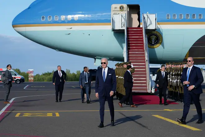 President Joe Biden walks to greet people as he arrives at Vilnius International Airport in Vilnius, Lithuania, Monday, July 10, 2023. Biden is in Lithuania to attend the NATO Summit. (AP Photo/Susan Walsh)