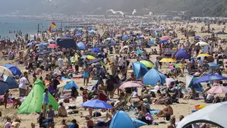 People enjoying the warm weather on Bournemouth beach