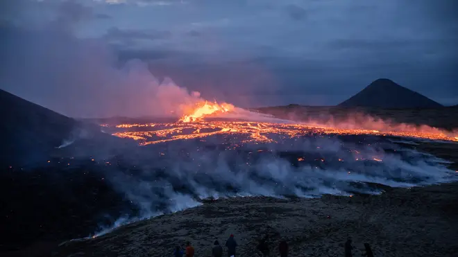 Lava emerges from a fissure of the Fagradalsfjall volcano near the Litli-Hrútur mountain