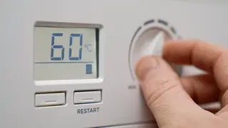 A home heating thermostat