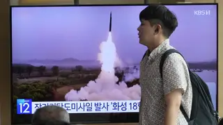 A TV screen in Seoul shows a file image of a North Korean missile launch