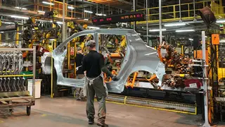 Workers on the production line at a Nissan factory in the UK