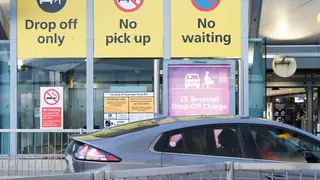 A car in a drop-off area at Heathrow airport