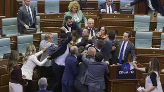 Legislators push each other as a brawl breaks out in Kosovo’s parliament in Pristina