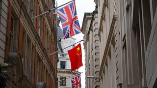 British and Chinese flags flying together
