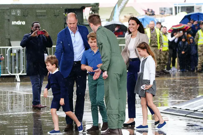 The family prepare to climb aboard a huge C-17 transporter aircraft, which was used to transport the late Queen's coffin in the days ahead of her funeral last September.