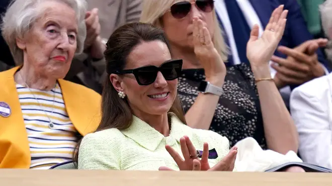 Kate smiled as she watched the pulsating final alongside Wimbledon legend Billie Jean King