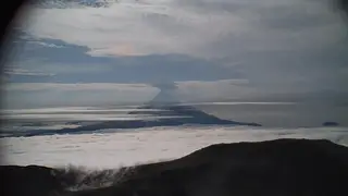 A low-level ash plume from Mount Shishaldin captured in an Alaska Volcano Observatory webcam
