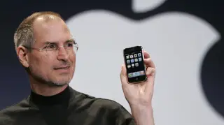 Apple chief executive Steve Jobs holding an Apple iPhone at the MacWorld Conference in January 2007 in San Francisco