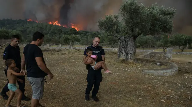 Children being evacuated from wildfires in Greece