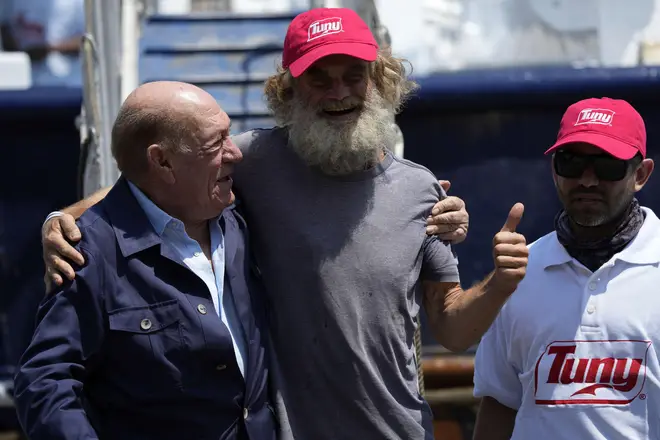 Shaddock was welcomed back to land by Grupomar boss Antonio Suarez, left, and Oscar Meza Oregon, the tuna boat's captain