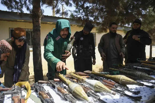 Taliban security personnel display