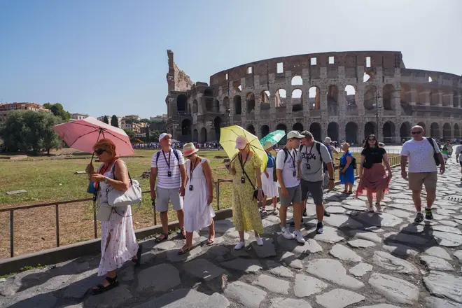 Tourists in Rome try to keep cool