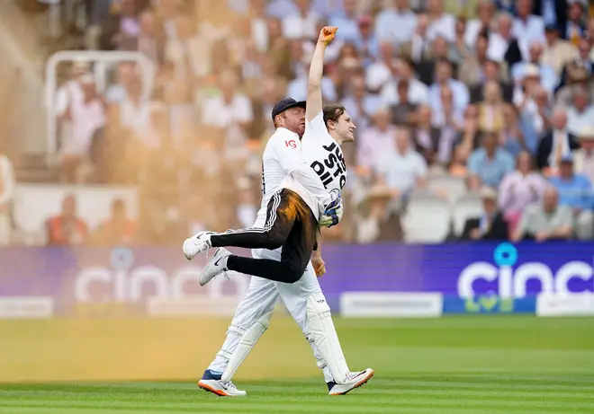 England's Jonny Bairstow removes a Just Stop Oil protester from the pitch during day one of the second Ashes test match at Lord's.