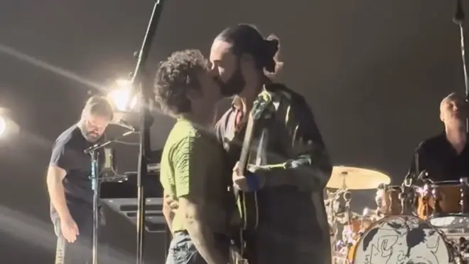Healy kissed guitarist Ross MacDonald onstage, prompting an "immediate cancellation directive" from the Malaysian government