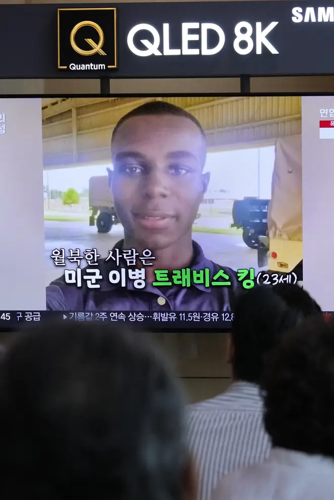 A TV shows an image of American soldier Travis King during a news programme at Seoul Railway Station in South Korea