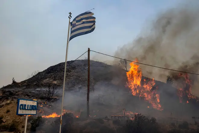 Flames burn a hill on Rhodes
