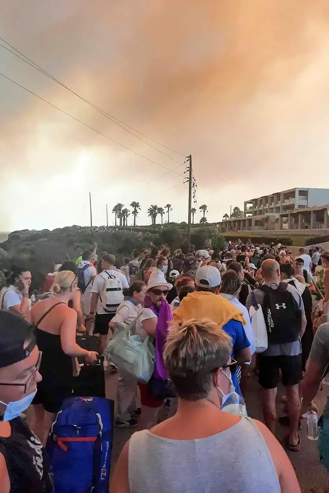 Tourists during the evacuation during a forest fire on the island of Rhodes