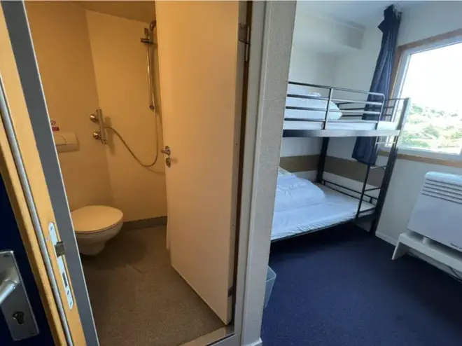 The bedroom shows a single-sized bunk bed, en-suite bathroom and a desk with a chair