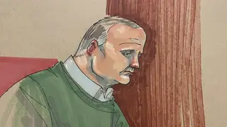 Court sketch artist drawing of Robert Bowers taking notes during sentencing