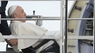Pope Francis boards his flight at Rome's Leonardo da Vinci International airport in Fiumicino to start his five-day pastoral visit to Portugal