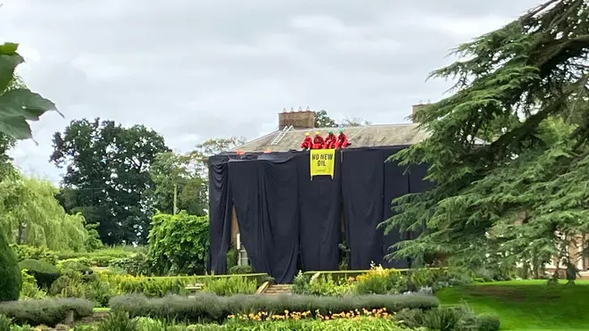 Protesters on the roof of the PM's home