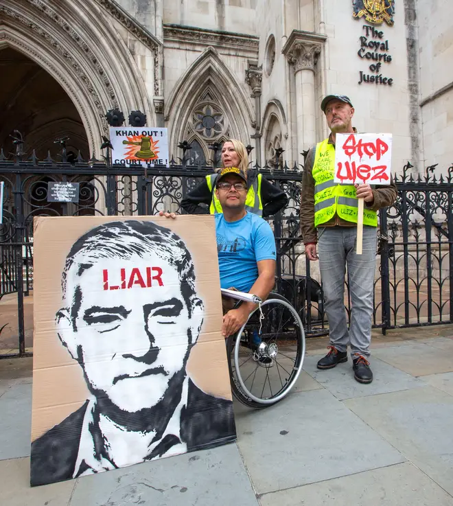 Activists stage a protest outside Royal Courts of Justice before the high court judge ruled in favor of Sadiq Khan's Ulez expansion.