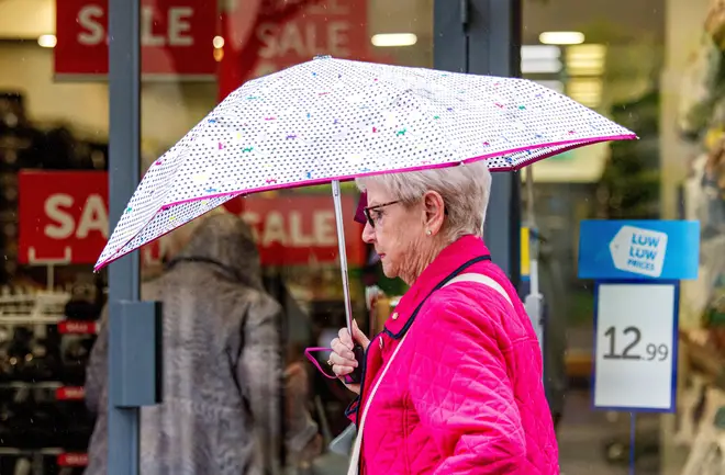 Shopper braces rainy weather
