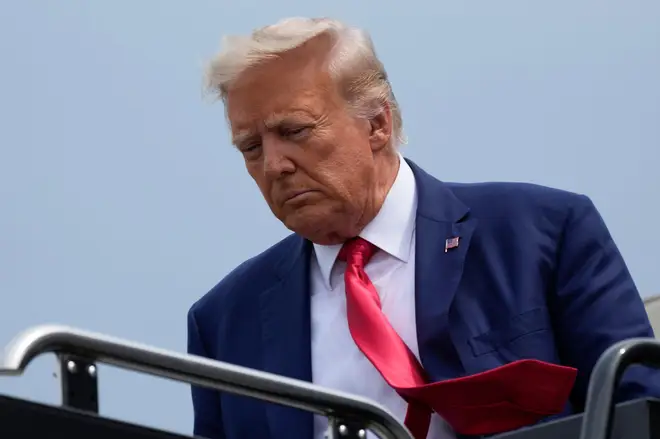 Former President Donald Trump looks sullen as he arrived in Arlington, VA