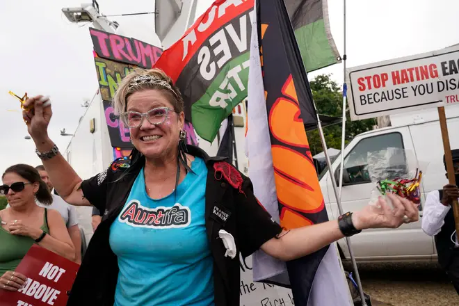 Protesters could be heard in the court