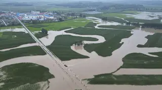 Floodwaters course through fields and roads in Kaiyuan Town of Shulan in north-eastern China’s Jilin province