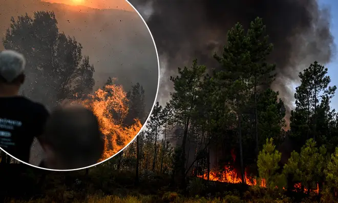 People watch on as wildfires spread through Portugal