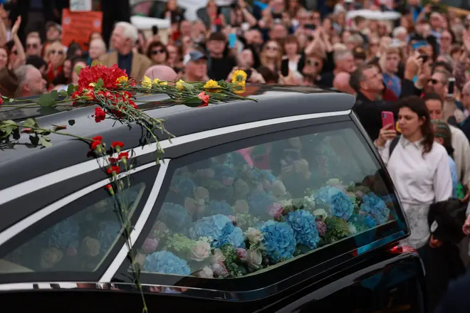 Fans of singer Sinead O'Connor line the streets for a 'last goodbye' to the Irish singer as her funeral cortege passes through her former hometown of Bray, Co Wicklow, ahead of a private burial service. Picture date: Tuesday August 8, 2023.