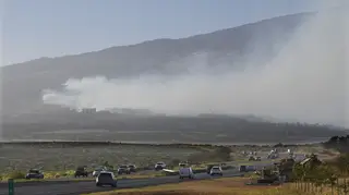 Smoke blows across the slope of Haleakala volcano on Maui, Hawaii