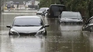 Vehicles are submerged in floodwaters caused by the tropical storm in Changwon, South Korea