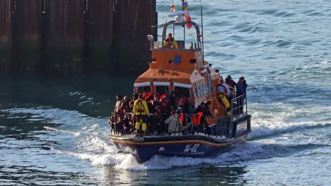 A group of people thought to be migrants are brought in to Dover, Kent.