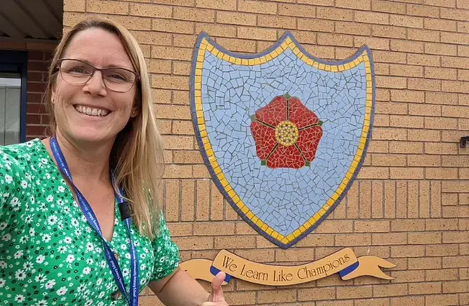Helen pictured outside of her school Worsley Mesnes Community Primary School where she was headteacher