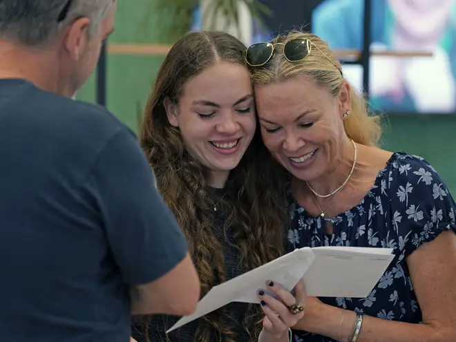 A delighted pupil gets her results at Brighton Girls school in Brighton, East Sussex