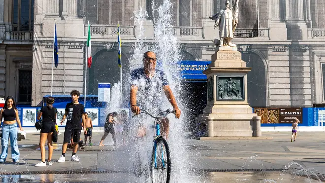 A man trying to keep cool in Italy's latest heatwave.