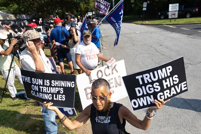 Trump supporters and adversaries have been gathering outside the jail