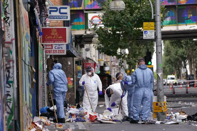 Forensics officers comb the scene in Ladbroke Grove, west London, where 21-year-old Takayo Nembhard, a rapper from Bristol, died after being stabbed on the final day of the Notting Hill Carnival