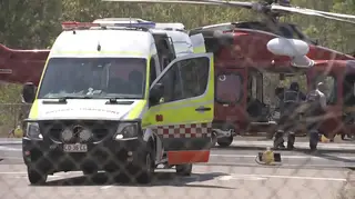A helicopter and ambulance involved in the rescue mission after the crash