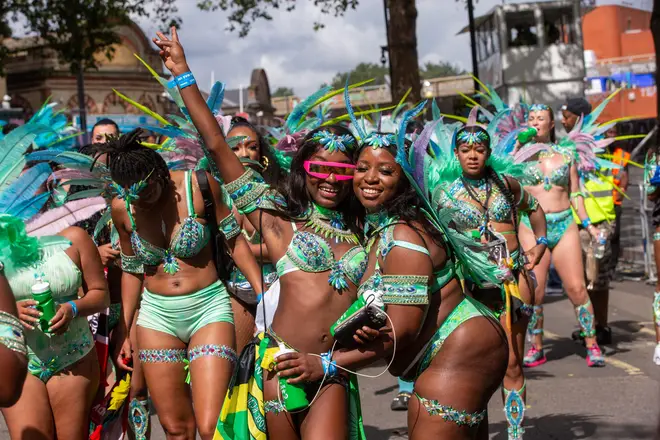 Participants in the Notting Hill Carnival celebration are seen in west London over the Summer Bank Holiday weekend.