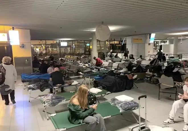 Frustrated passengers wait in Schiphol Airport in Amsterdam