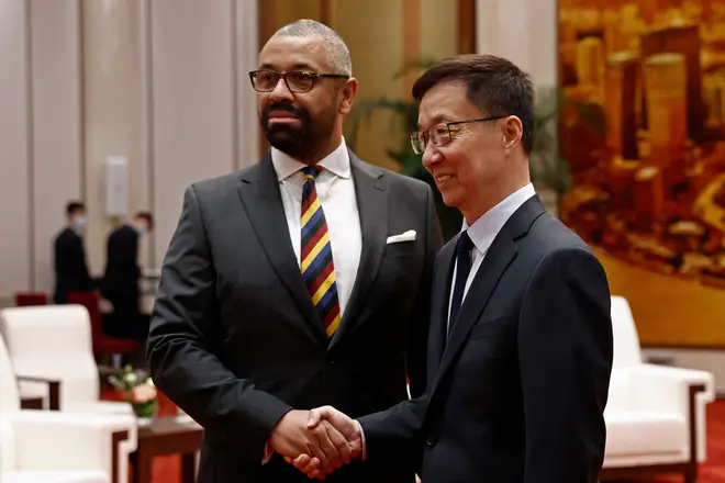 British Foreign Secretary James Cleverly, Chinese Vice President Han Zheng shake hands before a meeting at the Great Hall of the People in Beijing, China