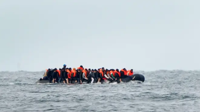 Migrants seen crossing the Channel on a small boat