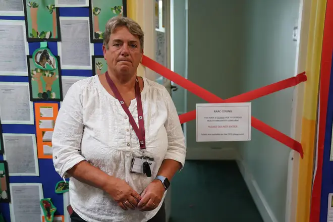 Caroline Evans, head teacher of Parks Primary School in Leicester stands next to a taped off section inside the school which has been affected