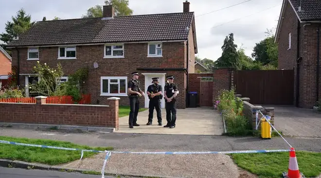 Police outside the house in Woking where Sara Sharif was found