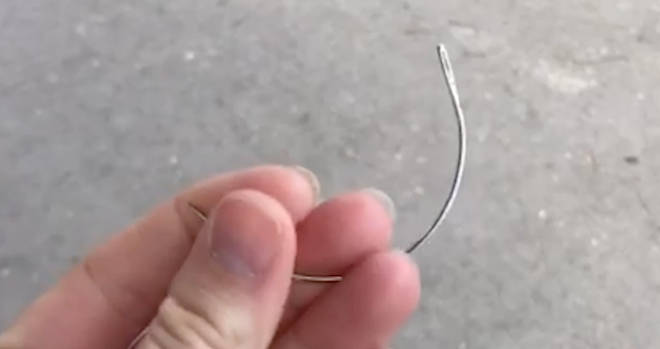 One of the hooked needles that teenagers are using to sew themselves up after being stabbed